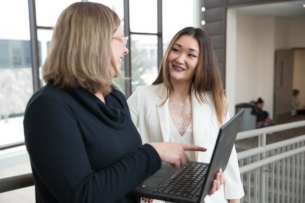 Professor helping student.